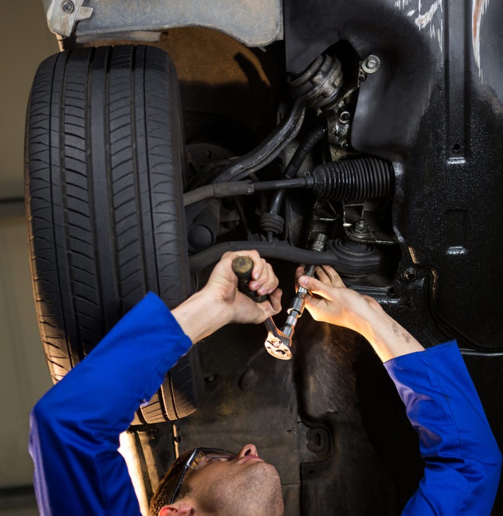 mechanic-servicing-car-scaled-1-1-1-1-1-1.jpg
